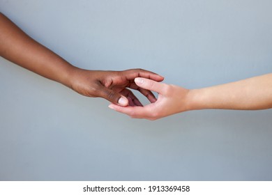 Black And White Female Hands Touching Each Other. Symbol Of Reconciliation And Stop Racism. Respect Between Peoples. Isolated Studio Background