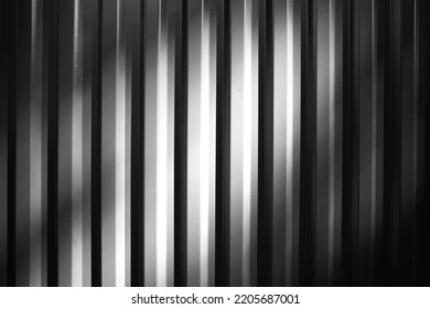 Black And White Fence Illuminated By Dramatic Light