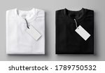 Black and white folded t-shirt with label.