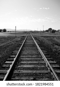 Black And White Forced Perspective Of Abandoned Railroad Tracks