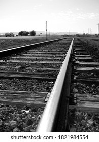 Black And White Forced Perspective Of Abandoned Railroad Tracks