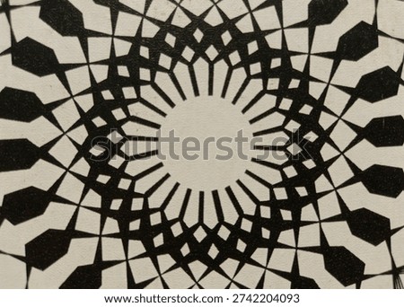 Black and white geometric Islamic pattern with symmetrical mandala design. Abstract ornamental background featuring intricate lines and radial shapes, perfect for wallpaper, textile, or decorative art.