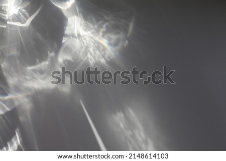 Black and white grain blur texture wall with rainbow refraction. Light and shadow smoke copy space abstract background. 