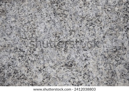 Black, white, grey spotted stone texture background