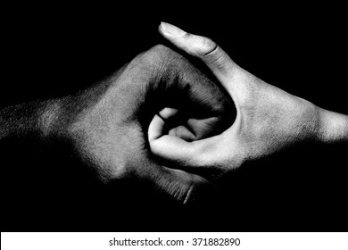 black and white hands holding together