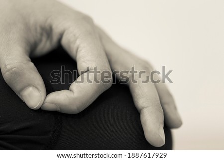 Black and white horizontal closeup of hand gesture or mudra, which directs energy and maintains focus during meditation by bringing tip of thumb and index fingers together, forming a circle Stock fotó © 