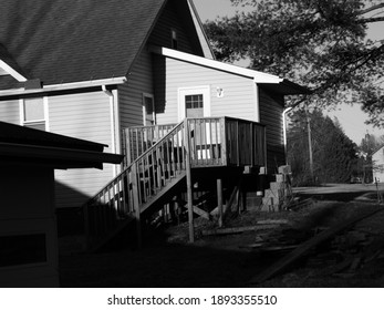 Black And White Of A House With A Messy Yard