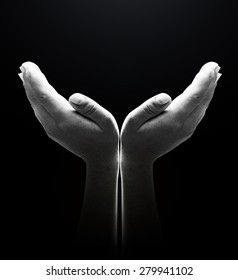 Black and white human open empty hands with palms up.