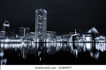 Black and white image of the Baltimore Inner Harbor Skyline at night