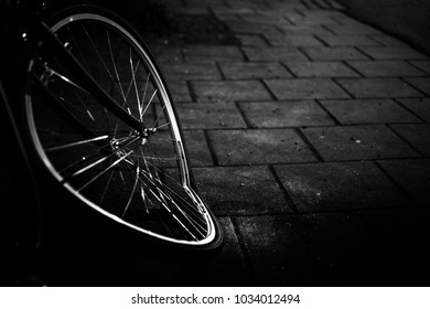 Black And White Image Of A Broken Bicycle Wheel