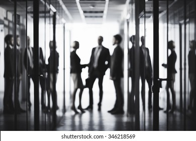 Black and white image of business people at office