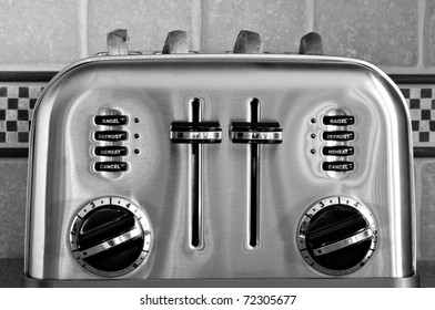 Black and white image of classic retro styled toaster with sliced bread.  Decorative tiled backsplash in background. - Powered by Shutterstock