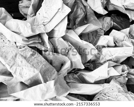 Black and white image of crumpled wrapping paper
