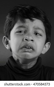 Black And White Image Of A Crying Boy