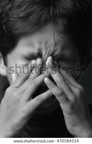 Black and white image of a crying boy