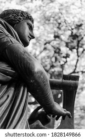 Black and white image elements of architecture and statues. 
