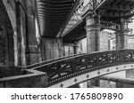 Black and white image of industrial viaduct structures and bridges from the industrial age in Castlefield in Manchester