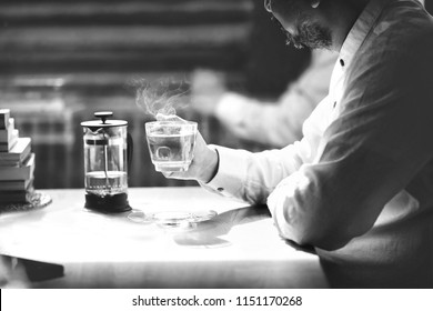 Black And White Image Of Mage Of 40s  Asian Elderly Drinking Tea.Muslim Man With Beard ,lonely With Tea Cup.He Looking Outside Or Flew Away .