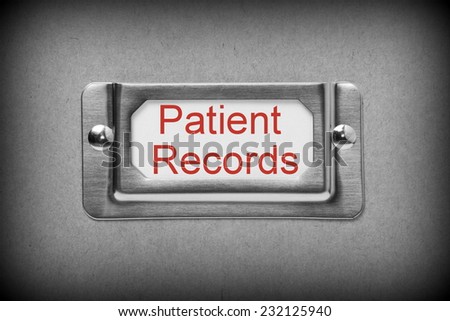 A black and white image of a metal drawer label holder with a white card and the title Patient Records added in red text
