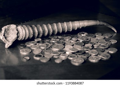 Black And White Image Of Money And Cornucopia (saiga Horn)