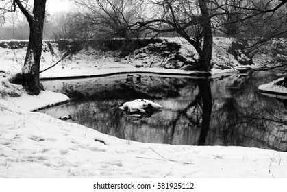 Black and white image of river in winter