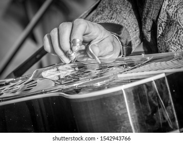 Black And White Image Of Slide Guitar Played In Blue Grass Band