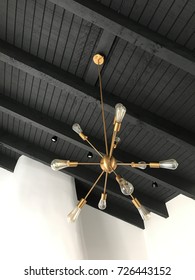 Black And White Interior Living Room . Modern Heigh Ceiling With Hanging Light .