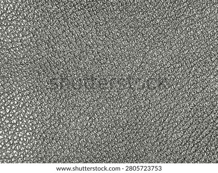 Black and white intricate pattern featuring densely packed curly, looping lines creating an abstract, textured visual effect.
