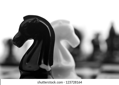 black and white knights on background