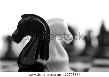 black and white knights on background
