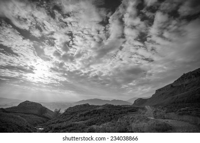 Black and white landscape with dramatic cloudy sky