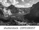 Black and white landscape view above Yosemite Valley of Half Dome granite rock formation in autumn, California, United States