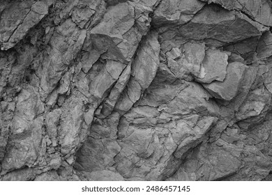 Black white light gray rock stone basalt mountain granite volcanic texture background. Close-up. 3d. Cracked, collapse, broken, crumbled.