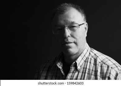 Black And White Low-key Portrait Of Middle-aged Man