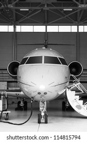 Black And White Luxury Business Private Jet In Hangar