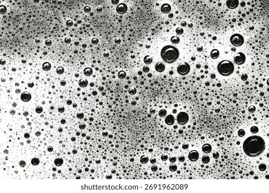 Black and white macro texture of bubbles and foam. Abstract surface background. Soap and water chemical reaction pattern. Artistic detail for modern creative design.
