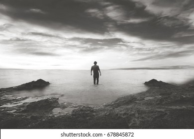 Black And White Man Walking In The Water In A Wonderful Sea