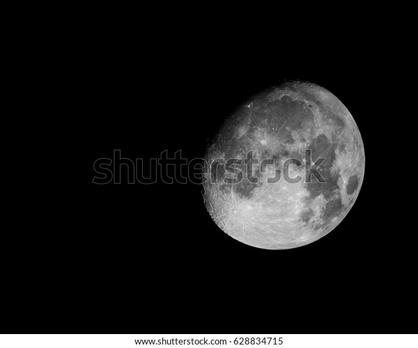 Black and\
white Moon separated from black\
background