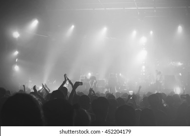 Black and White of Music concert crowds illuminated from stage lights (very shallow depth of field)