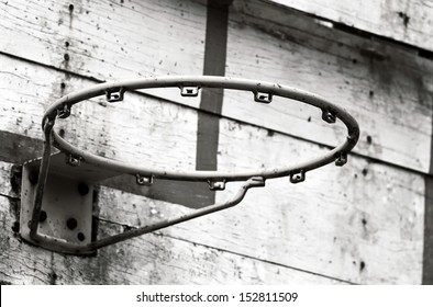 Black And White Of Old Outdoor Basketball Hoop And Backboard In School