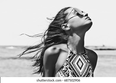 Black And White Outdoor Fashion Photo Of Beautiful Happy Woman At Sea. Beach Travel. Summer Vibes