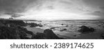 Black and white panorama of california coastline at sunset 