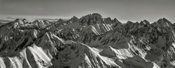 Black And White Panorama Of The High Tatras, Snowy Peaks In Winter, Aerial View. Slovak And Polish Tatras. Winter Landscape.