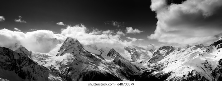 Black and white panorama of snow mountain at winter day. Caucasus Mountains, region Dombay. View from ski slope. - Powered by Shutterstock