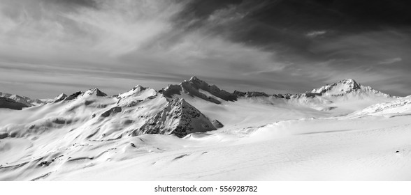 Black and white panorama of snow mountains in winter evening. Caucasus Mountains, Elbrus Region. View from off-piste slope of Elbrus. - Powered by Shutterstock