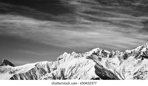 Black and white panoramic view on winter mountains at sun winter day. View from ski lift on Hatsvali, Svaneti region of Georgia. Caucasus Mountains. - Powered by Shutterstock