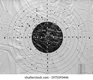 Black And White Paper Target Hit By An Arrow. Target After Competition In Crossbow Shooting