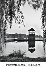 Black And White Photo Of Alum Lake 'Kamencove Jezero' In Chomutov City With Wooden Pier At The End Of The Summer Tourist Season