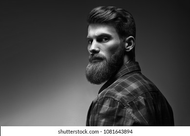 Black and white photo of bearded stylish businessman Handsome confident perfect hairstyle man indoor . - Shutterstock ID 1081643894