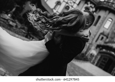 Black And White Photo Of Beautiful Married Couple Dancing Outside